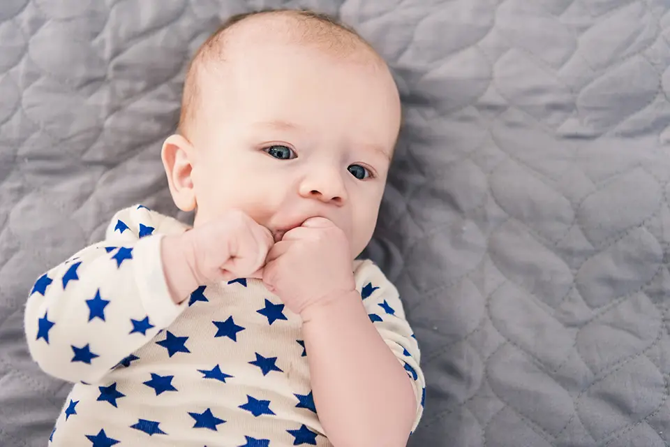 overhead-view-of-adorable-little-baby - Zara Dental Clinic - Houston Pediatric Thumb-Sucking: When It Affects Jaw Development