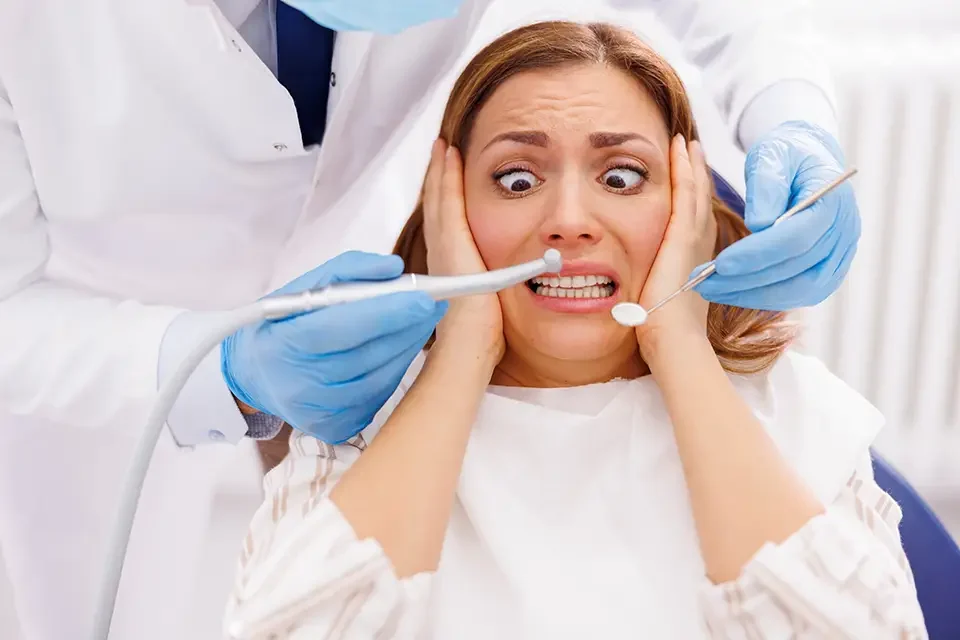 afriad woman at dental office The Tori Removal Procedure at Zara Dental