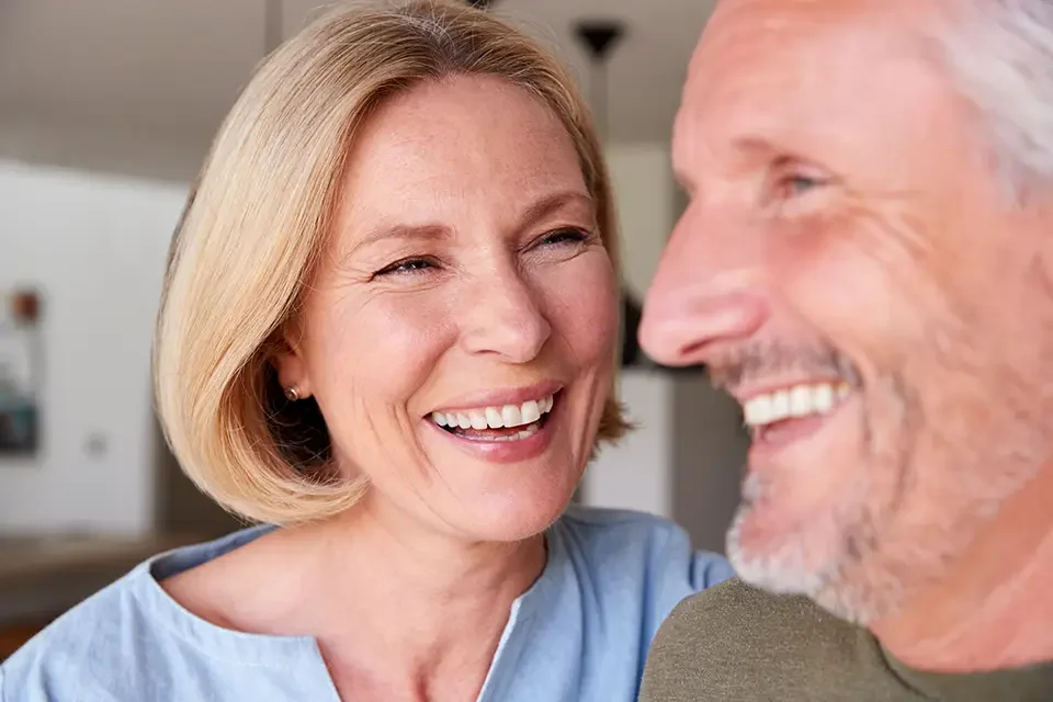close-up-of-smiling-senior-couple-standing-at-home Same Day Dental Implants Cost in Houston