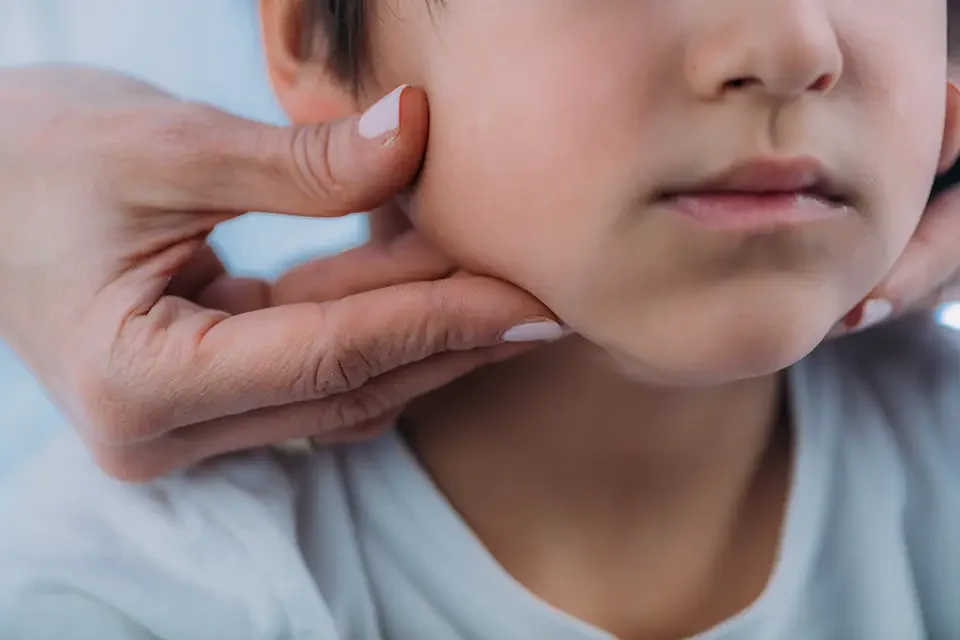 pediatric-endocrinologist-examining-preschooler Pediatric Orthodontics Thumb Sucking: When to Step In