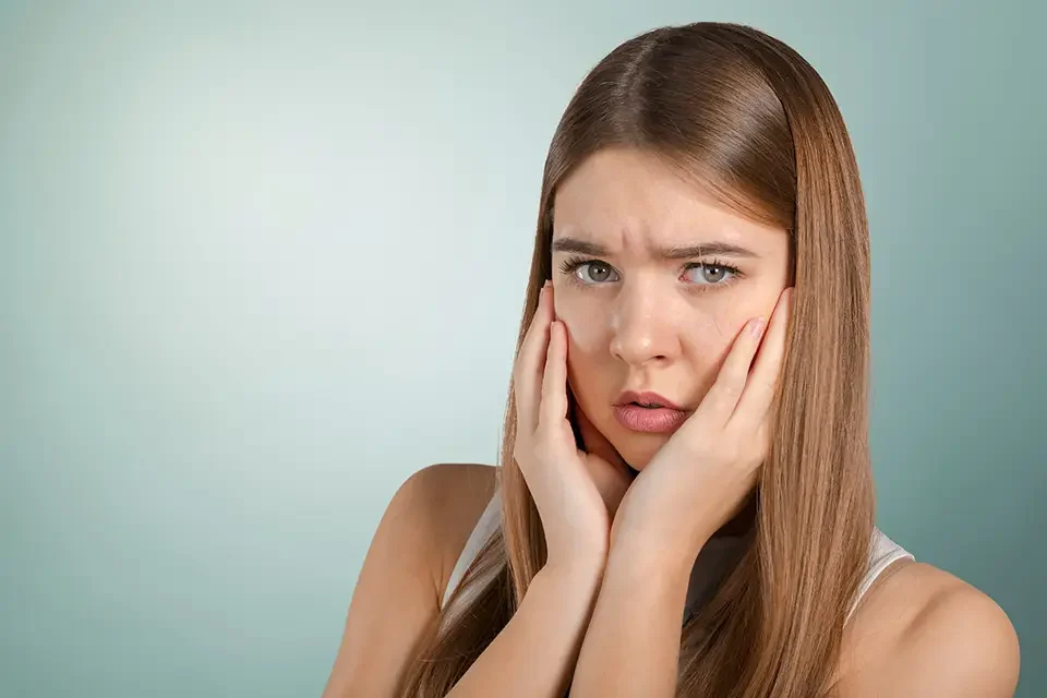 portrait-of-young-woman-with-toothache Common Causes of Post-Root Canal Tooth Pain